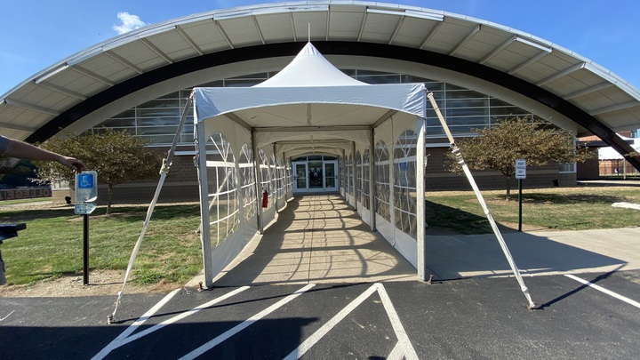Covered walkway tent structure at university entrance