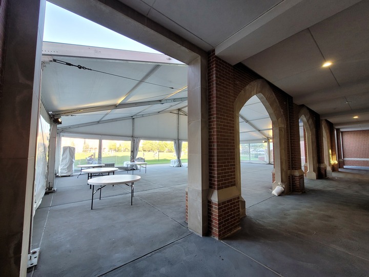 Interior view of academic event tent with professional setup