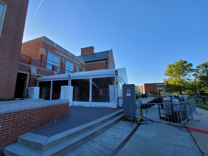 Campus building entrance with tent extension