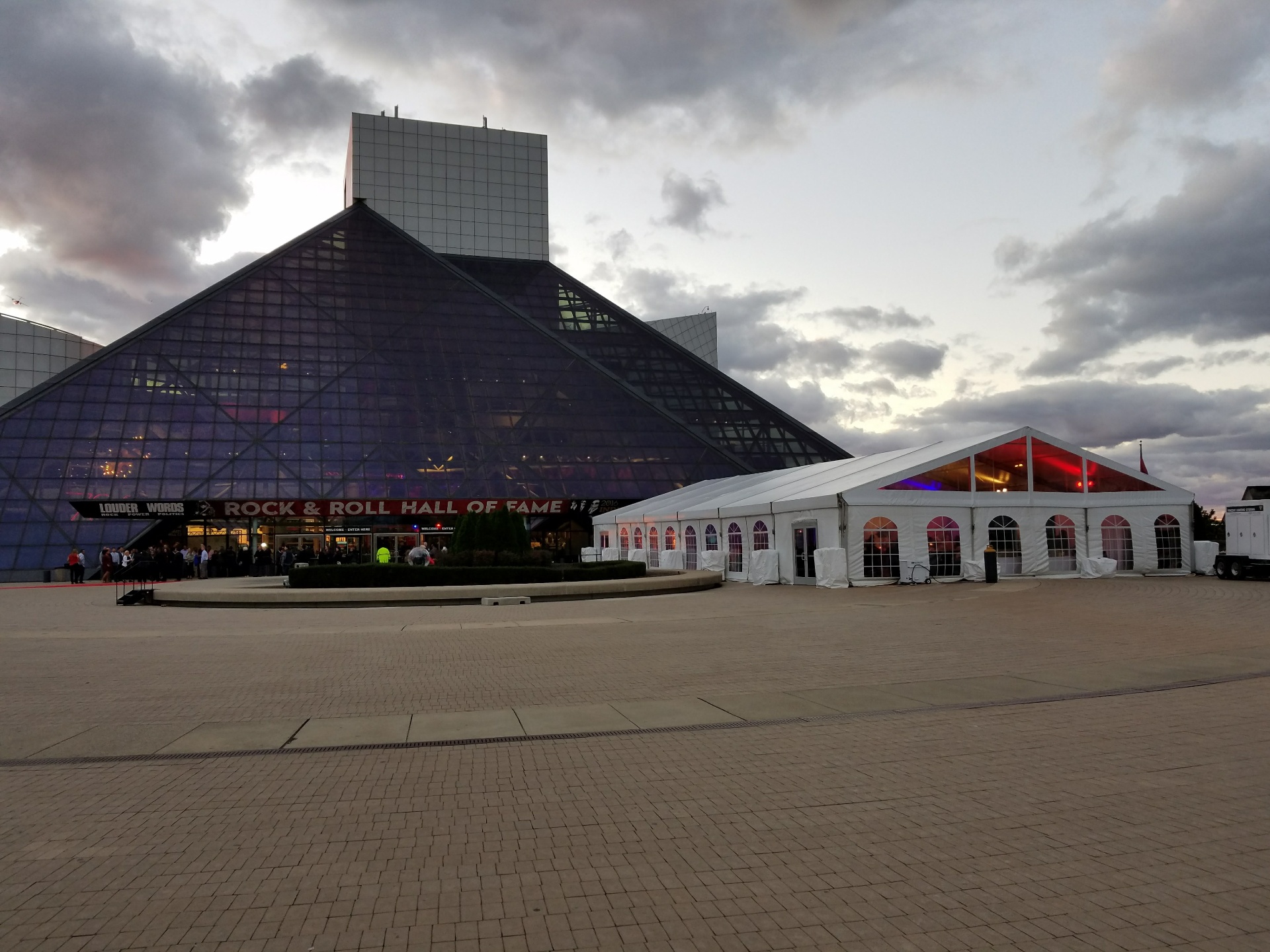 Corporate tent at Rock & Roll Hall of Fame with dramatic evening lighting