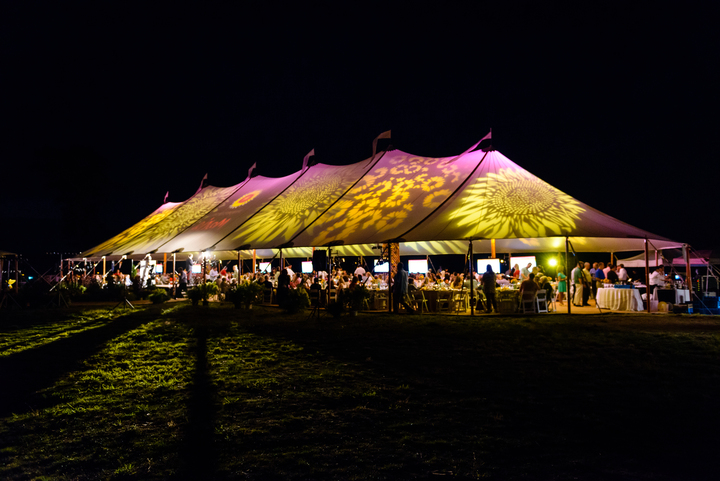 Corporate tent with projection mapping at night