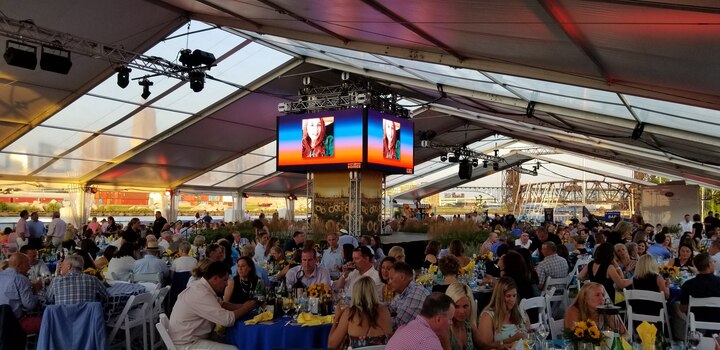 Large corporate event with clear tent and AV production