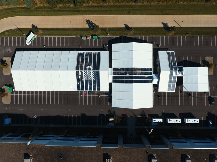 Aerial view of multiple pole tents for large corporate event