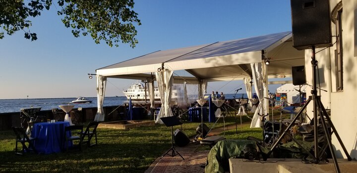 Waterfront corporate event with clear-top tent