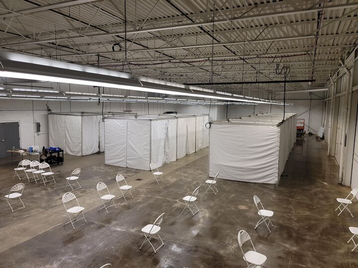 Large-scale emergency response facility with climate control and partition systems