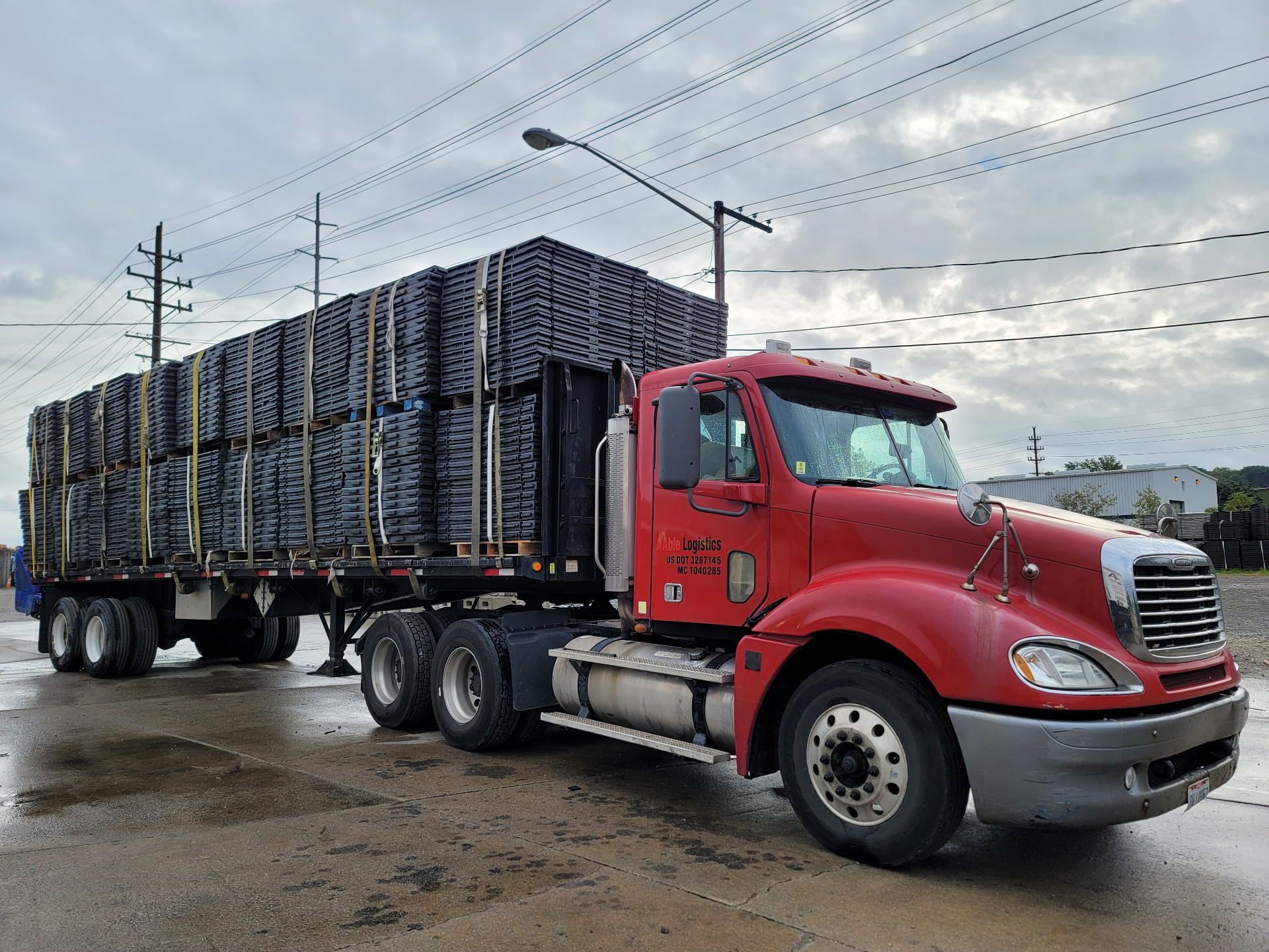 AAble Logistics truck transporting emergency shelter components for disaster relief