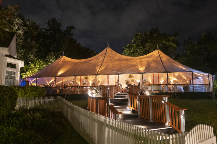 Elegant wedding tent with sailcloth and raised deck