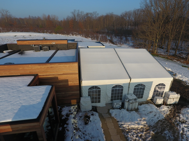 Aerial view of winter residential event tent with windows