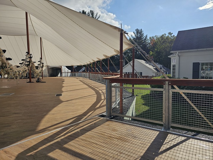 Sailcloth tent wedding with Coastal Railing system on raised wood deck platform