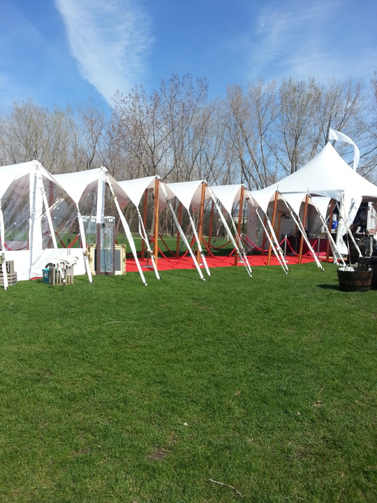 Wave marquee tent with clear walls and red carpet entrance